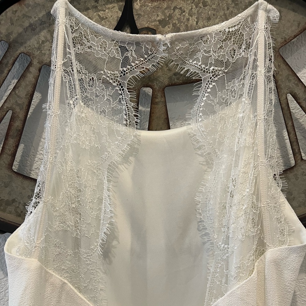Lacy, knee-length dress.
